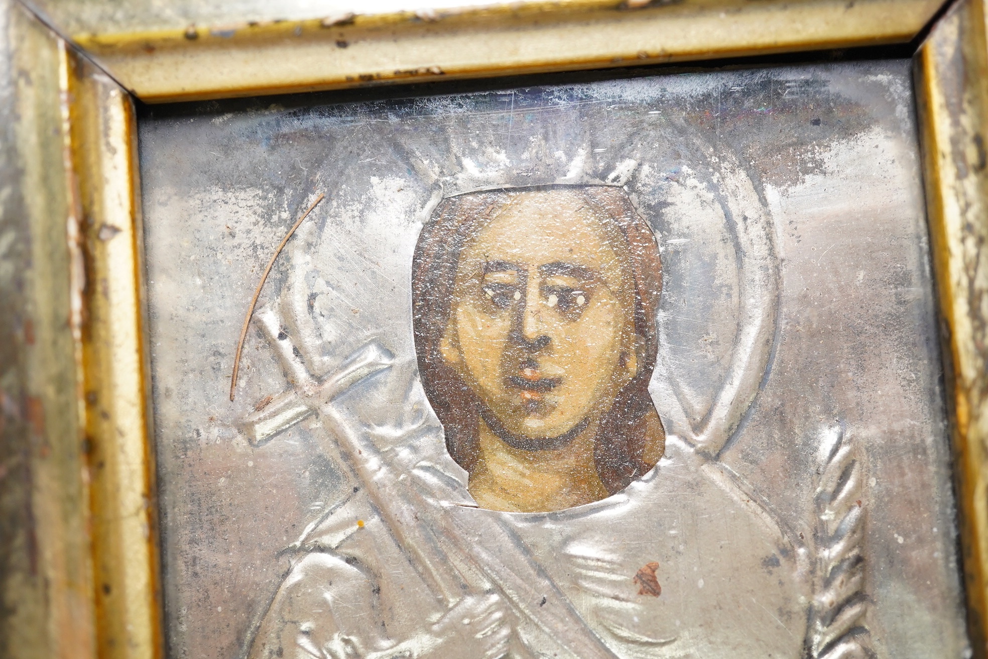 An 18th/19th century Russian silver overlaid icon together with another, largest 12 x 9cm. Condition - fair
